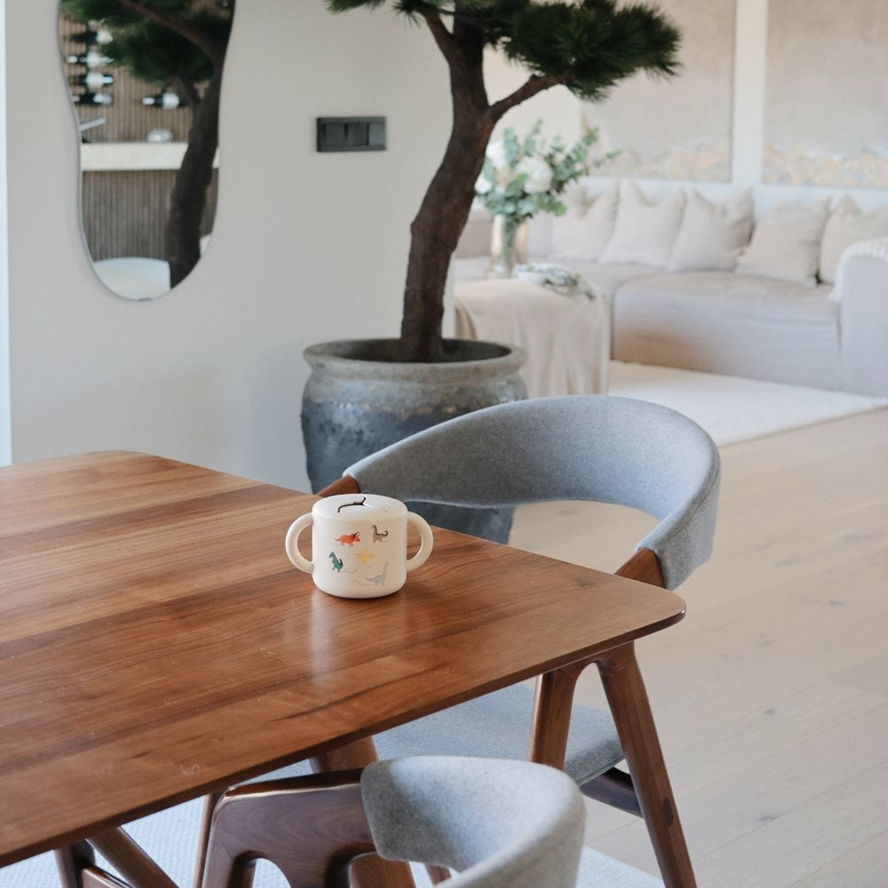 Mushie® Silikonska posodica za prigrizke Dinosaurs Mushie